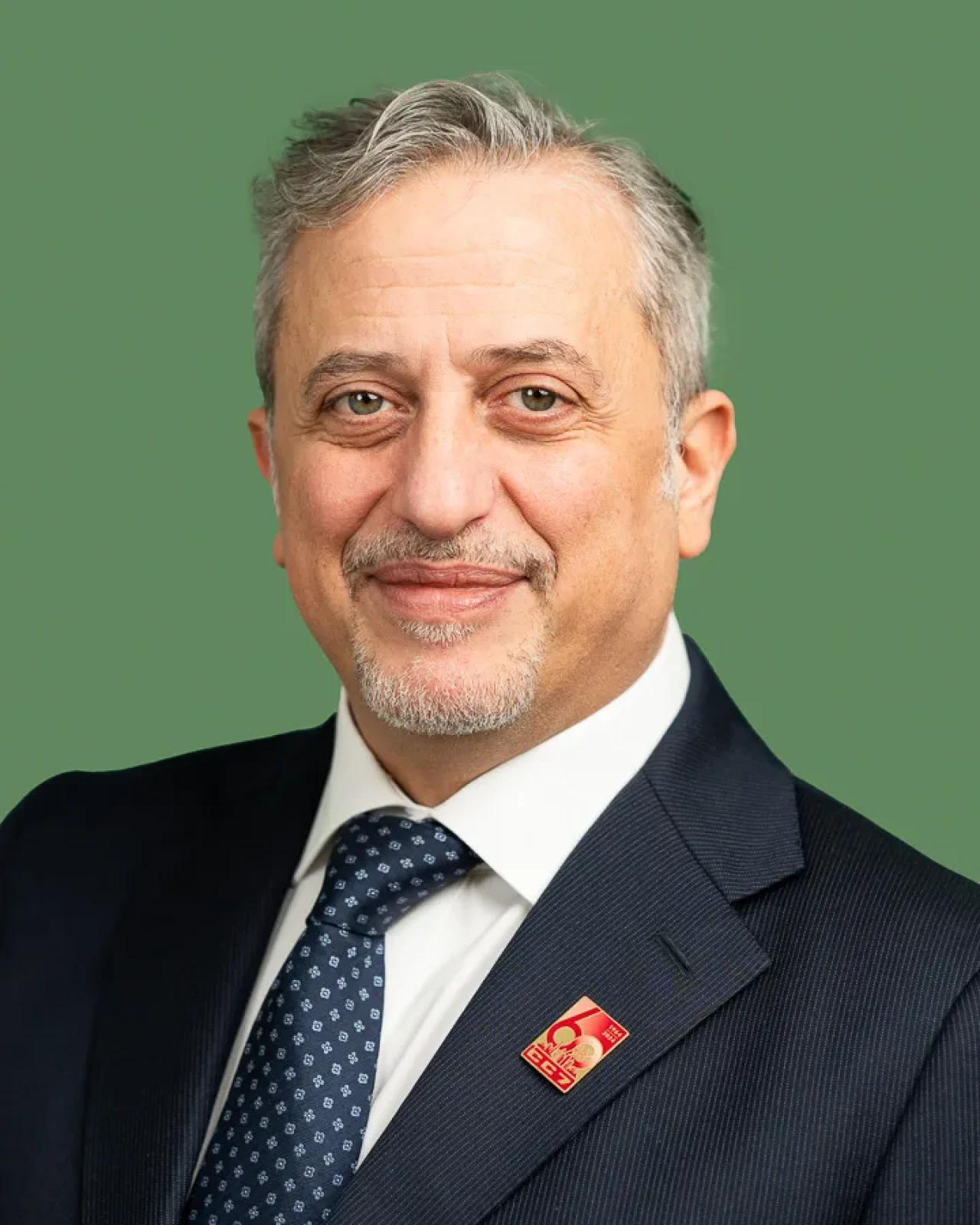 Smart man looking at camera on a green background. Smart man looking at camera on a green background.